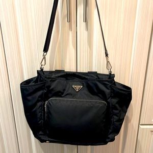 Prada black diaper bag has many zippers and pouches two bottle holders